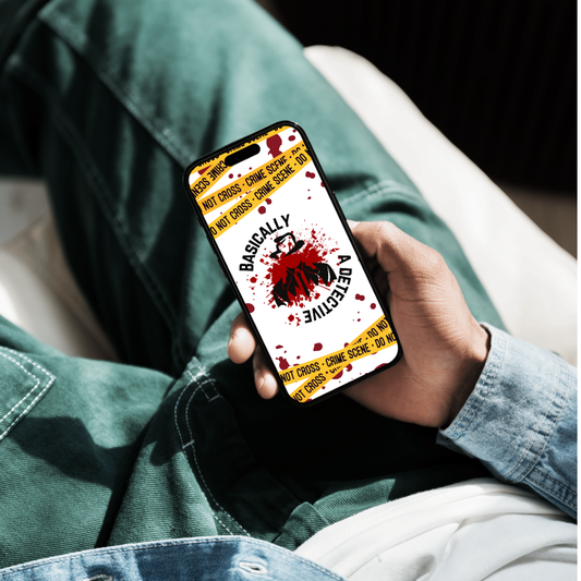 Person holding a phone with a 'Basically a Detective' themed case, sitting on a couch.