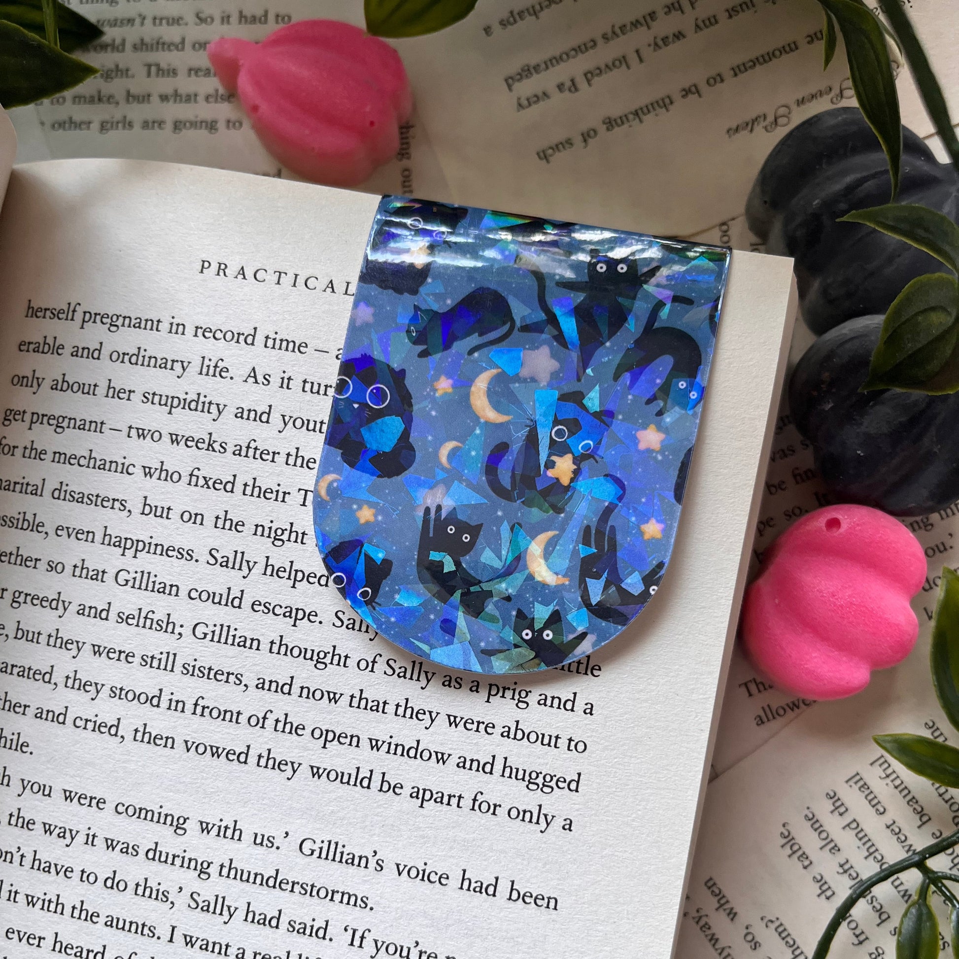 Blue magnetic bookmark with cats floating in space surrounded by stars and moons
